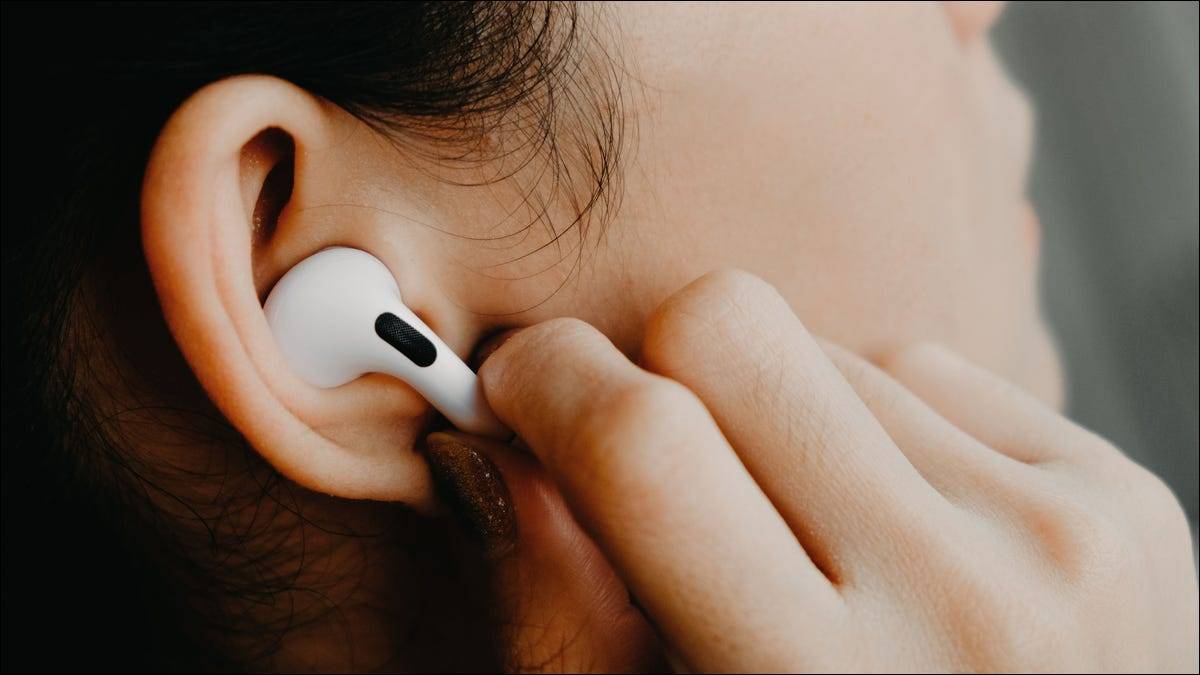 someone-using-the-touch-controls-on-airpods someone-using-the-touch-controls-on-airpods